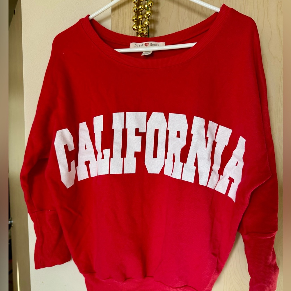 Still in very good condition. Cute light sweater long sleeve, bright red.
